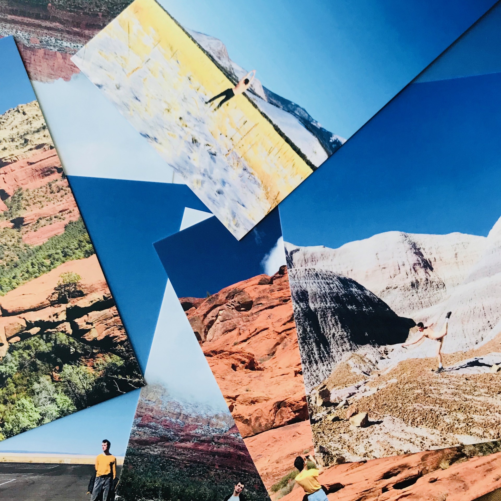 Pile of photographs of male model in American southwestern landscapes.