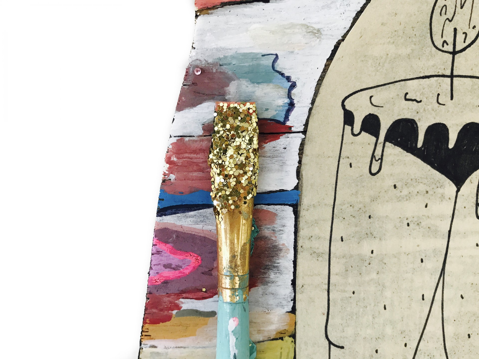 Up close detail of painting. Shows glitter coated paintbrush and melted candle wax drawing. 