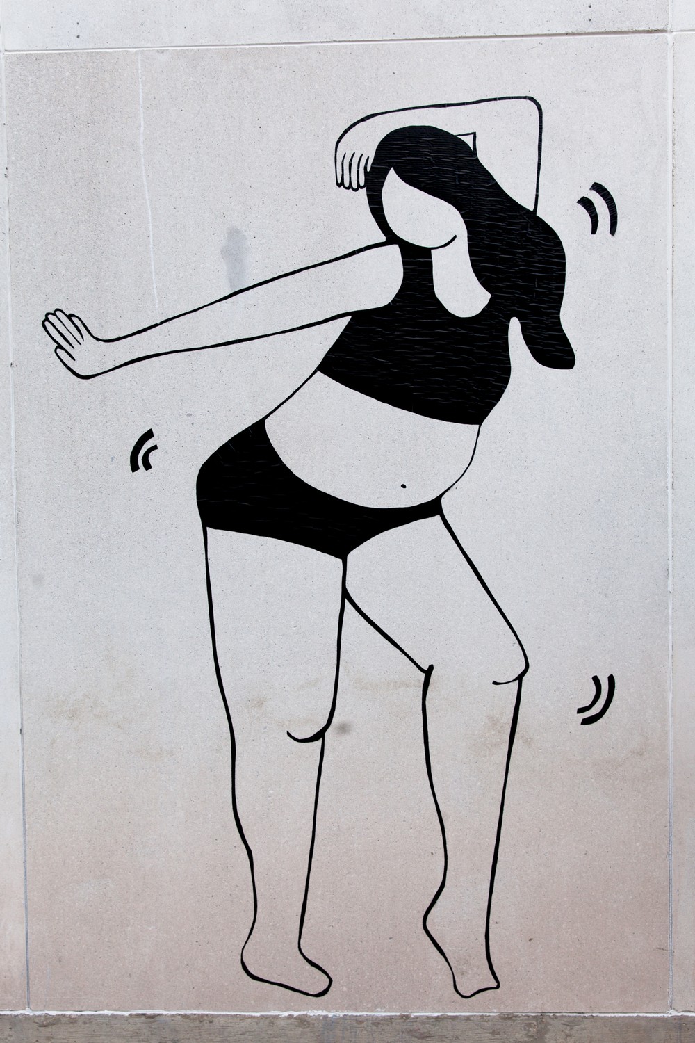 Image of single woman in mural dancing in underwear.