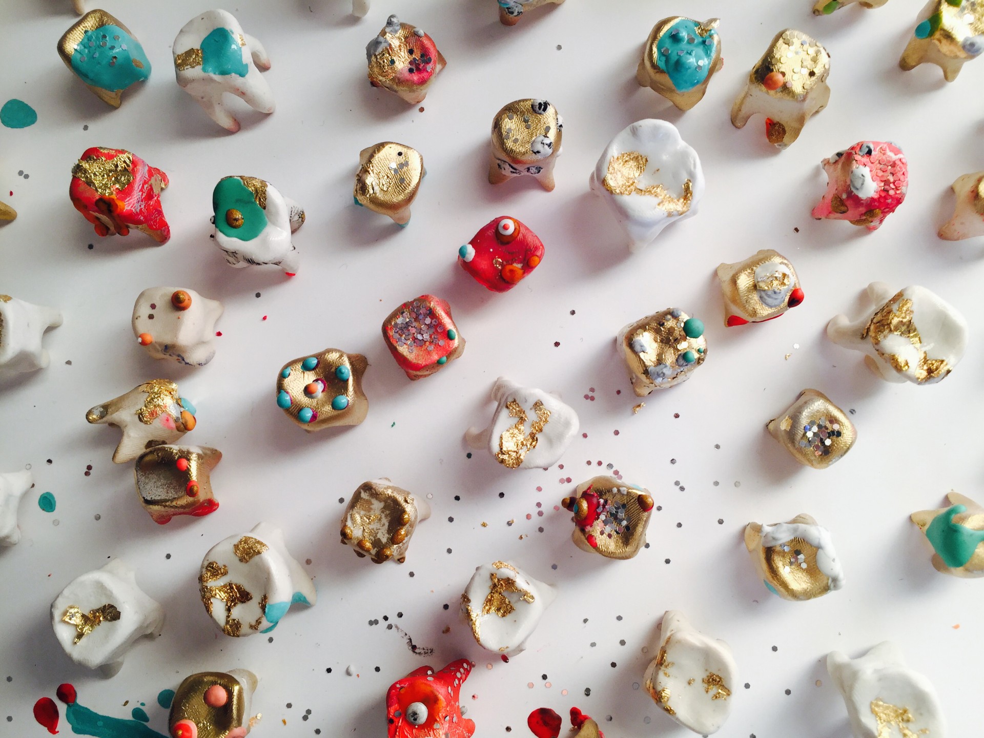 Birds eye shot of colorful teeth on white surface. 