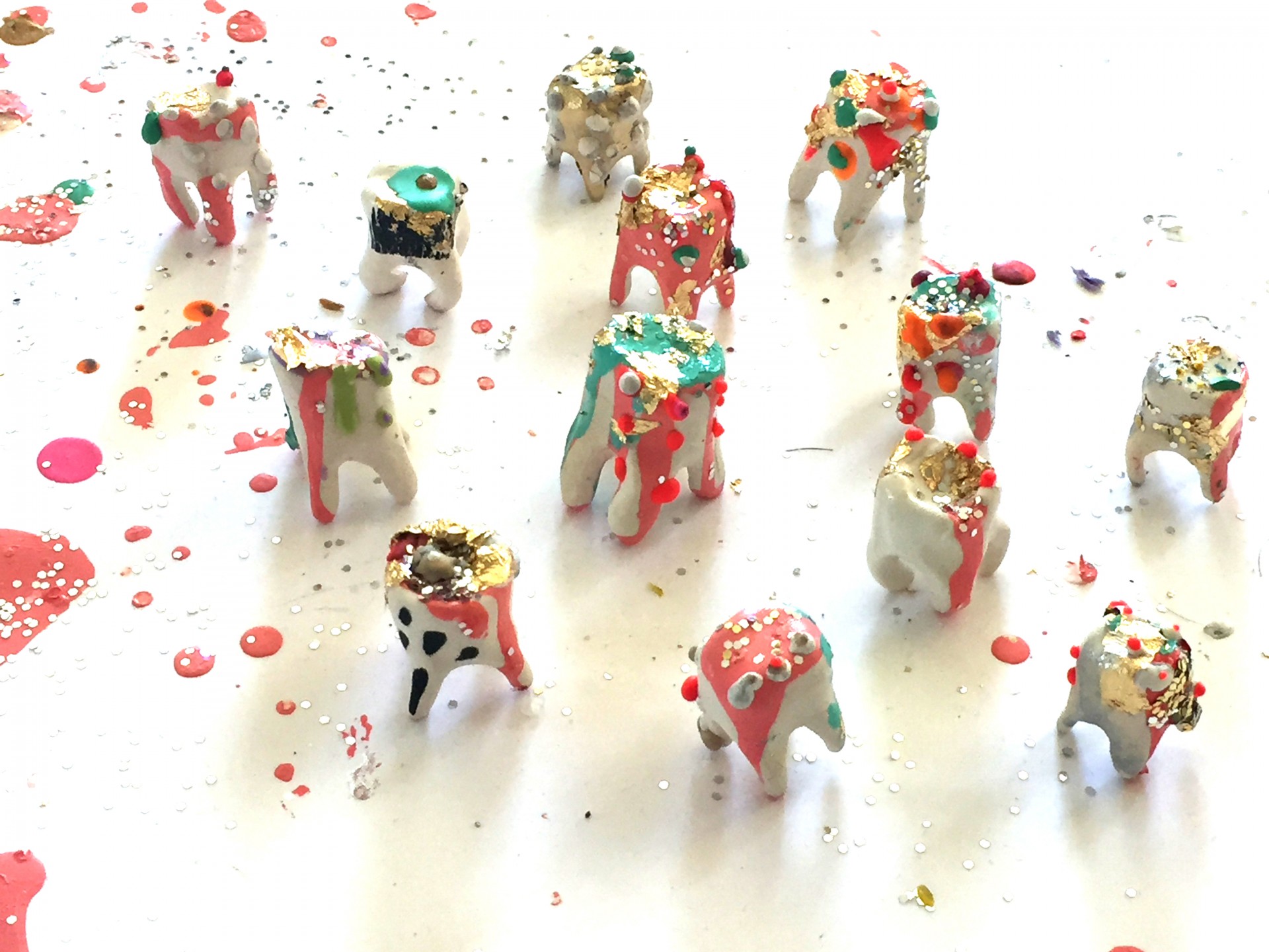 Birds eye shot of colorful teeth on white surface. 