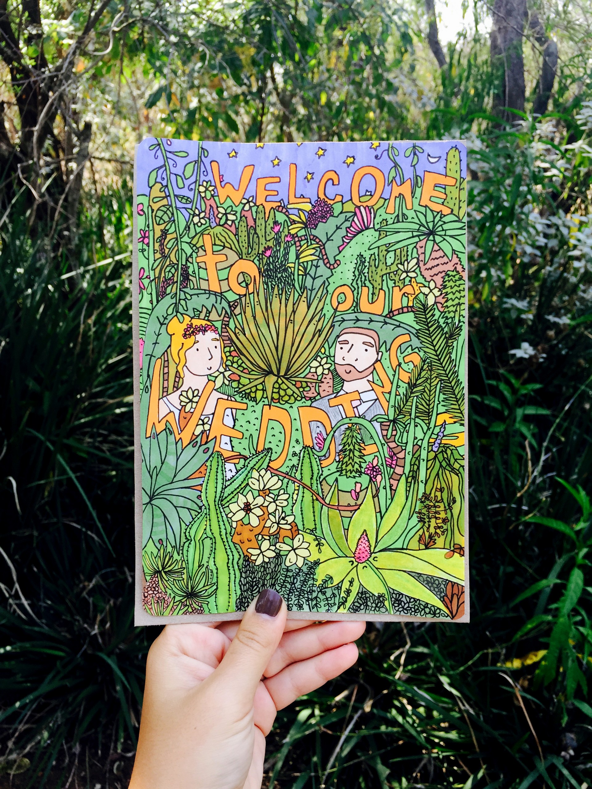 Bride and groom in South African inspired flora with text that reads "Welcome to Our Wedding"