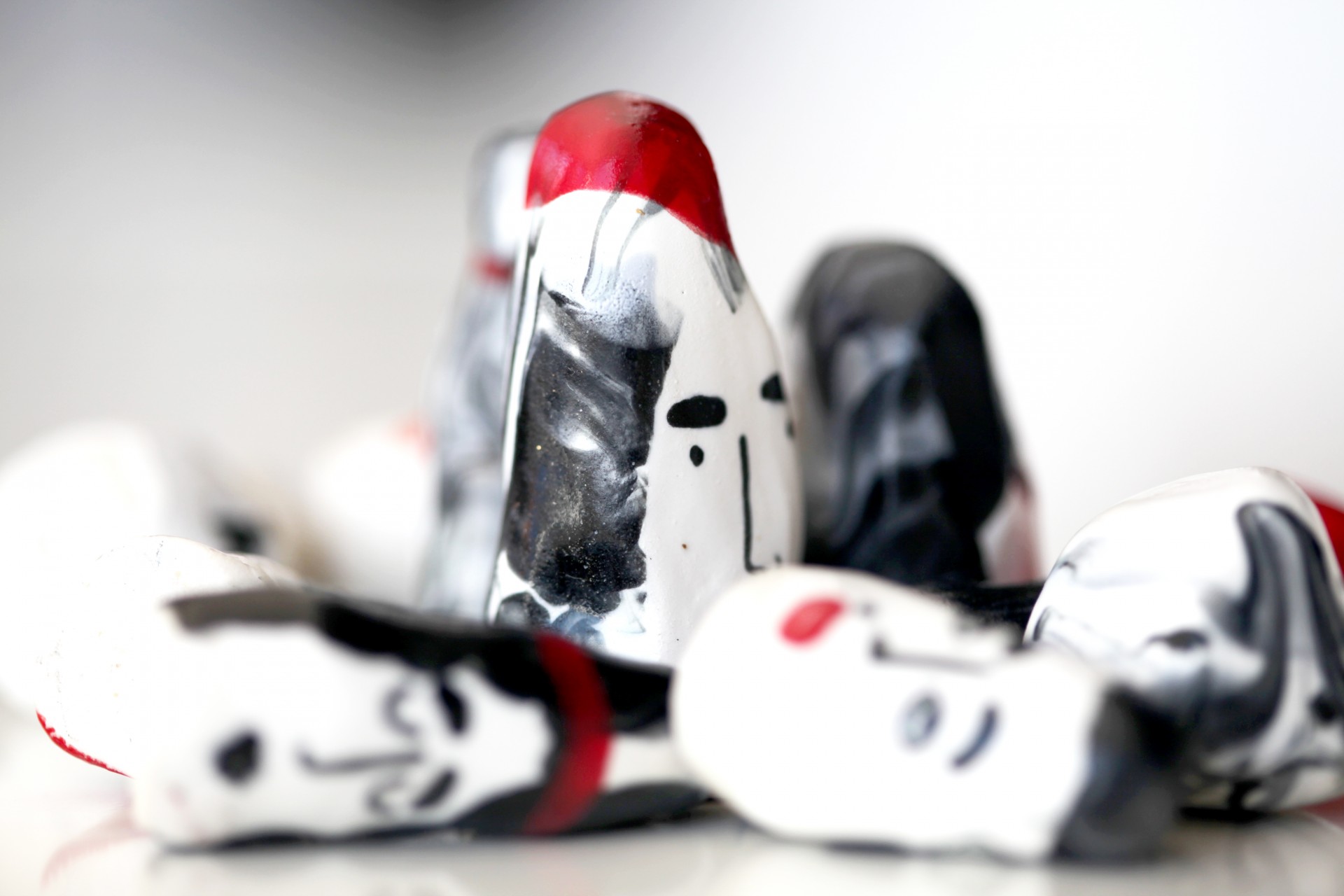 Cluster of porcelain heads on white background. 